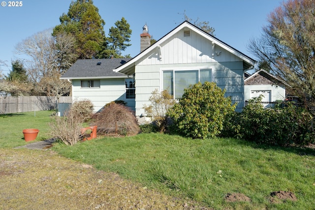 878 NW Warrenton Dr, Warrenton, OR 97146 - back of property with a chimney, a yard, and fence