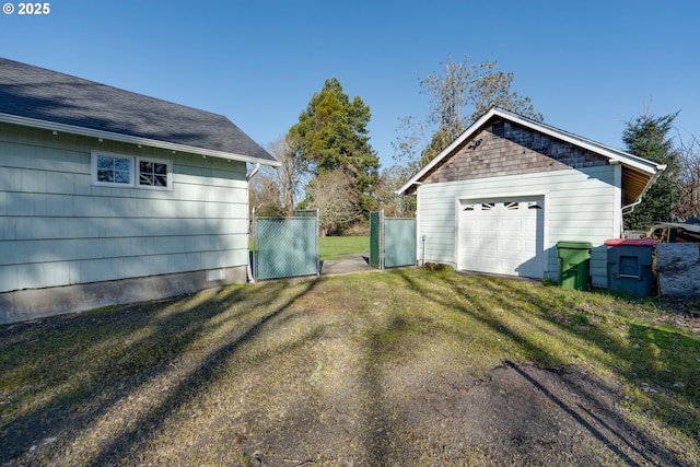 878 NW Warrenton Dr, Warrenton, OR 97146 - detached garage featuring driveway and fence