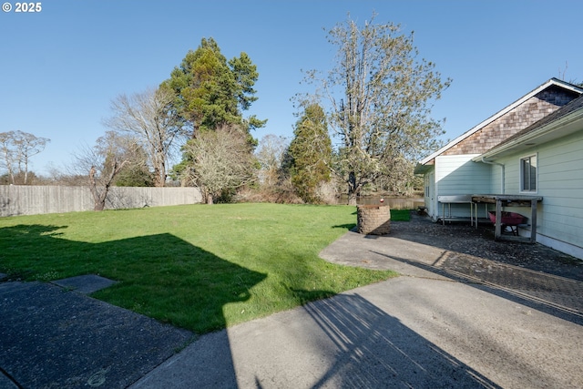 878 NW Warrenton Dr, Warrenton, OR 97146 - view of yard featuring a patio and a fenced backyard