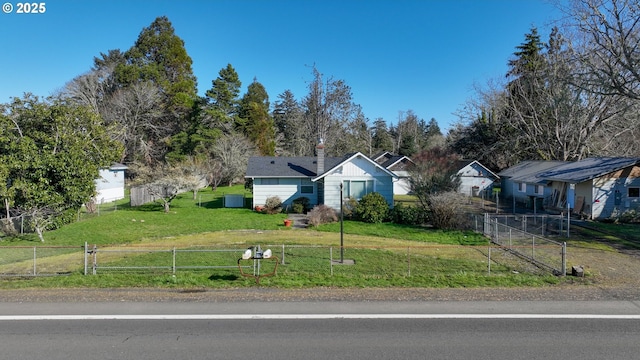 878 NW Warrenton Dr, Warrenton, OR 97146 - view of front facade featuring a front lawn and fence