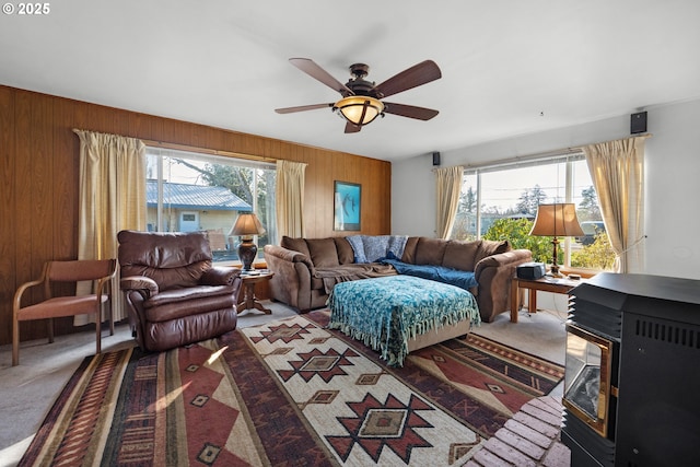 878 NW Warrenton Dr, Warrenton, OR 97146 - living room with carpet flooring, a ceiling fan, and wooden walls