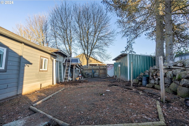 111 N Trade St, Amity, OR 97101 - view of yard featuring fence and an outdoor structure