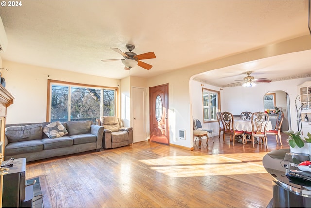 111 N Trade St, Amity, OR 97101 - living room featuring visible vents, ceiling fan, arched walkways, and wood finished floors