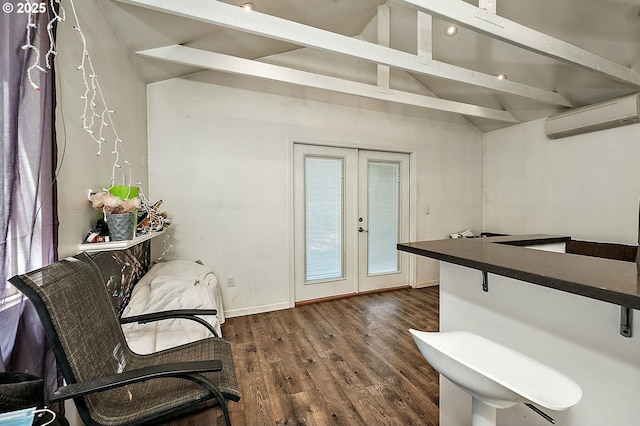 interior space with vaulted ceiling with beams, baseboards, a wall mounted air conditioner, french doors, and dark wood-style floors