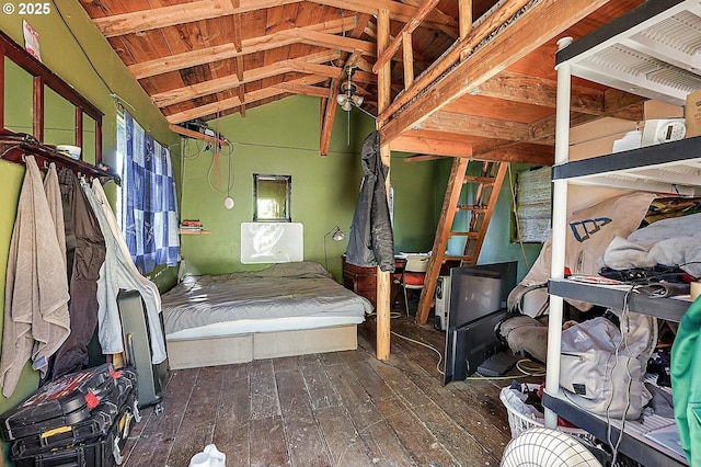 unfurnished bedroom featuring lofted ceiling and hardwood / wood-style flooring