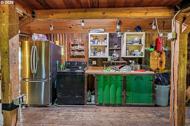 kitchen featuring wooden walls, wood ceiling, hardwood / wood-style floors, freestanding refrigerator, and black electric range oven