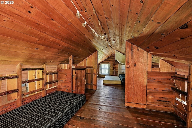 unfurnished bedroom with lofted ceiling, wood ceiling, hardwood / wood-style floors, and wood walls