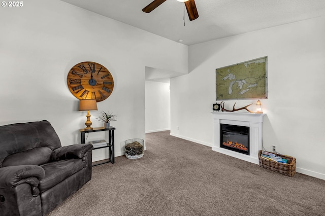 117 E Cushman St, Yacolt, WA 98675 - living area with carpet, a ceiling fan, a glass covered fireplace, and baseboards