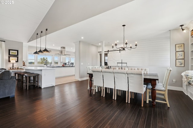 20265 SE Poco Ln, Amity, OR 97101 - dining area featuring a chandelier, dark wood-style floors, recessed lighting, lofted ceiling, and baseboards