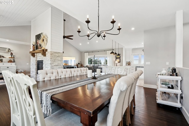 20265 SE Poco Ln, Amity, OR 97101 - dining space featuring vaulted ceiling, dark wood finished floors, a stone fireplace, a chandelier, and ceiling fan