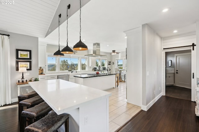 20265 SE Poco Ln, Amity, OR 97101 - kitchen with island exhaust hood, a center island, recessed lighting, white cabinetry, and ceiling fan