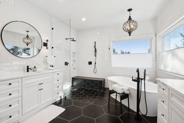 20265 SE Poco Ln, Amity, OR 97101 - full bath featuring vanity, tiled shower, tile walls, a freestanding bath, and a chandelier