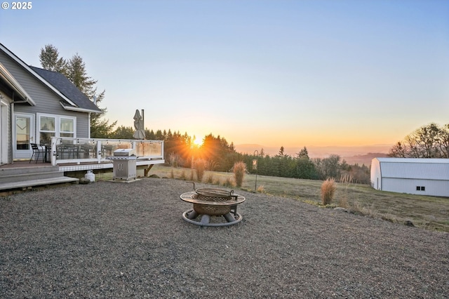 20265 SE Poco Ln, Amity, OR 97101 - view of yard featuring a fire pit and a wooden deck
