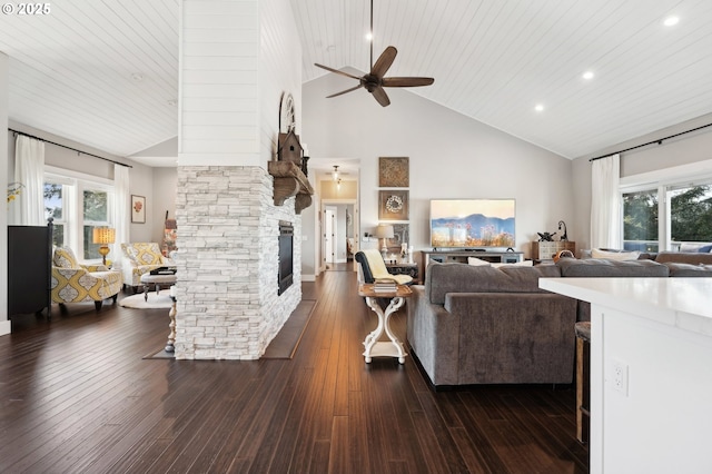 20265 SE Poco Ln, Amity, OR 97101 - living area featuring high vaulted ceiling, a ceiling fan, a fireplace, dark wood-style flooring, and wooden ceiling