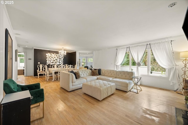 living room with an inviting chandelier and wood-type flooring