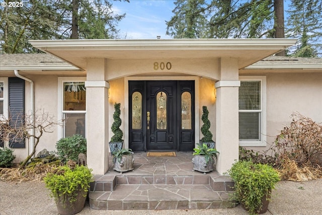 property entrance featuring a porch