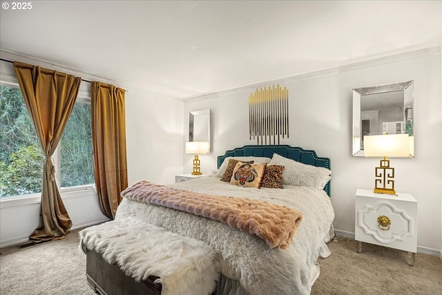 carpeted bedroom featuring crown molding