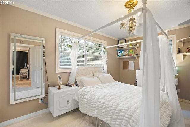 bedroom featuring ornamental molding and a textured ceiling