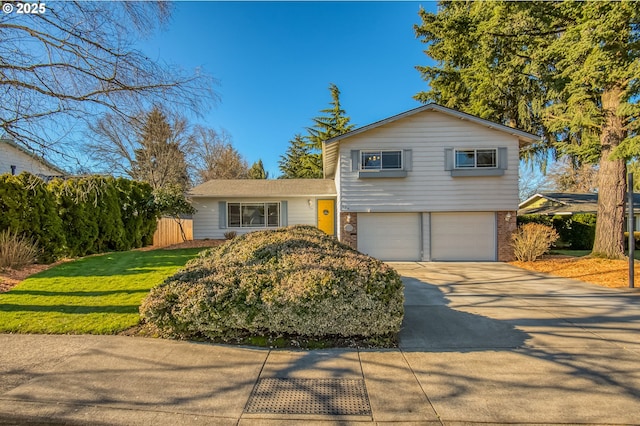 view of front of home with a garage and a front yard