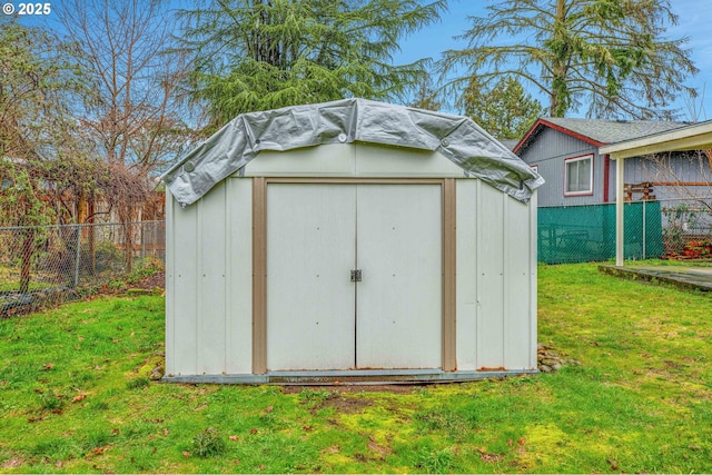 view of outdoor structure featuring a lawn