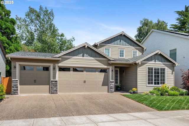 3466 N Holladay St, Cornelius, OR 97124 - craftsman house featuring a garage, board and batten siding, stone siding, concrete driveway, and a front lawn
