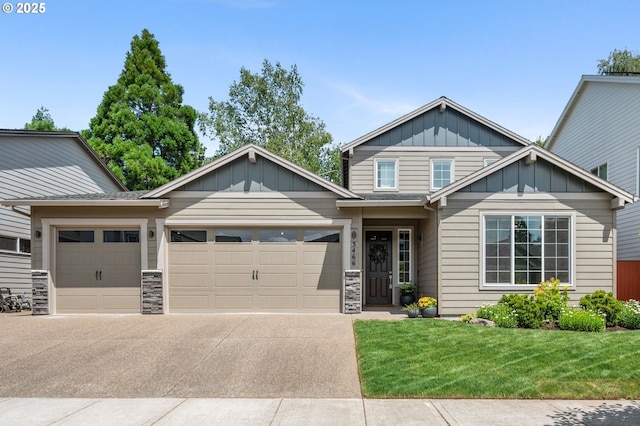 3466 N Holladay St, Cornelius, OR 97124 - craftsman-style house featuring an attached garage, board and batten siding, a front yard, driveway, and stone siding