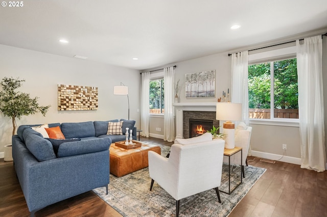 3466 N Holladay St, Cornelius, OR 97124 - living area featuring a fireplace, dark wood-style flooring, and recessed lighting