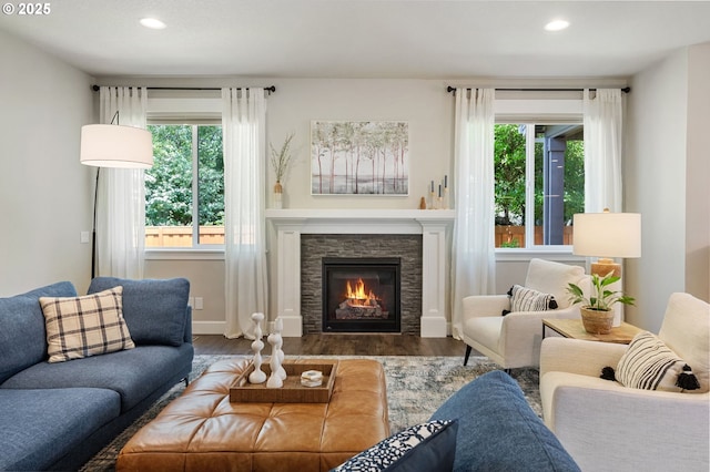 3466 N Holladay St, Cornelius, OR 97124 - living area featuring wood finished floors, recessed lighting, and a stone fireplace