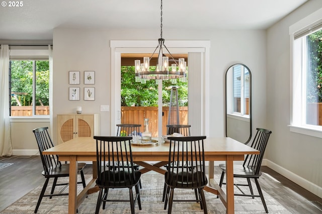 3466 N Holladay St, Cornelius, OR 97124 - dining room featuring a chandelier and wood finished floors