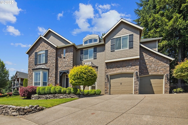 3534 NW Maple St, Camas, WA 98607 - craftsman-style home featuring stone siding, driveway, a front yard, and an attached garage