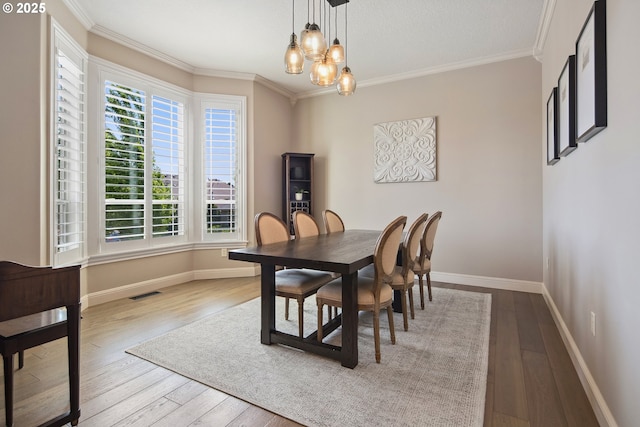3534 NW Maple St, Camas, WA 98607 - dining area with hardwood / wood-style flooring, baseboards, ornamental molding, and a chandelier
