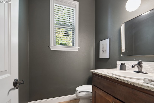 3534 NW Maple St, Camas, WA 98607 - half bathroom featuring vanity, toilet, healthy amount of natural light, and baseboards