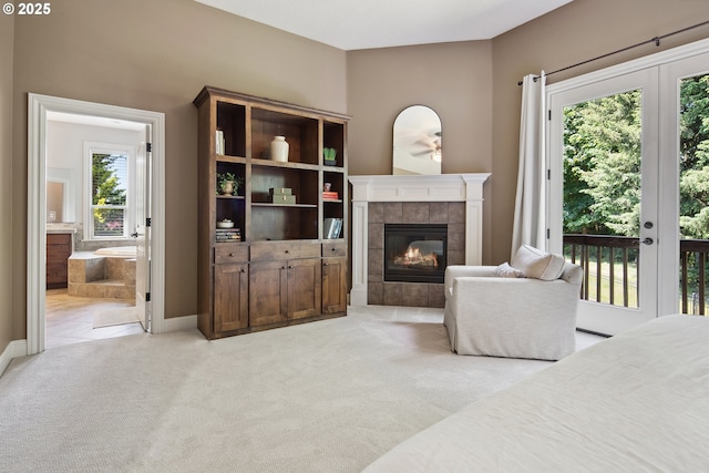 3534 NW Maple St, Camas, WA 98607 - bedroom with access to outside, a fireplace, light carpet, and multiple windows