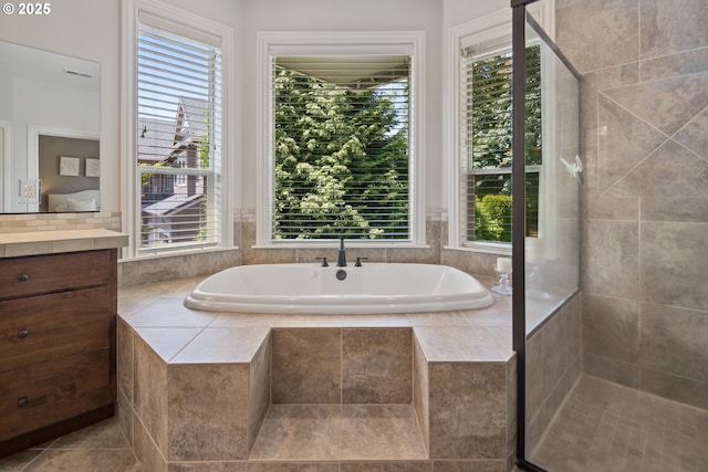 3534 NW Maple St, Camas, WA 98607 - bathroom with healthy amount of natural light, a garden tub, vanity, and tiled shower