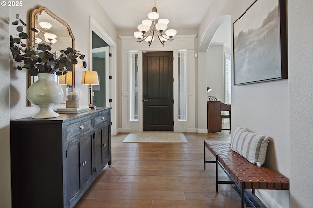 3534 NW Maple St, Camas, WA 98607 - foyer entrance with a chandelier, hardwood / wood-style flooring, arched walkways, and baseboards