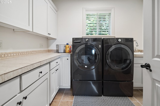 3534 NW Maple St, Camas, WA 98607 - washroom featuring washing machine and dryer, cabinet space, and tile patterned floors