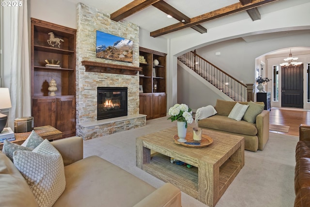3534 NW Maple St, Camas, WA 98607 - living room featuring beam ceiling, a chandelier, stairs, arched walkways, and carpet floors