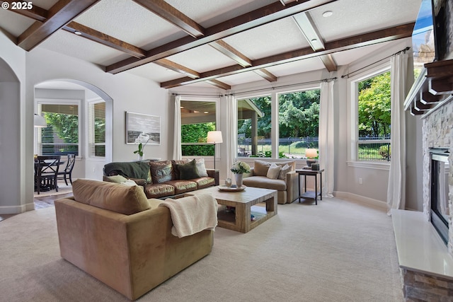 3534 NW Maple St, Camas, WA 98607 - living room with light colored carpet, coffered ceiling, beam ceiling, baseboards, and arched walkways