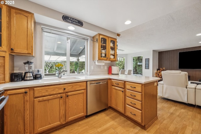 16111 NW Paisley Dr, Beaverton, OR 97006 - kitchen with dishwasher, a sink, open floor plan, a peninsula, and healthy amount of natural light
