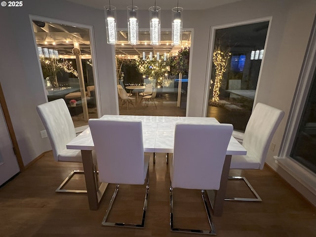 16111 NW Paisley Dr, Beaverton, OR 97006 - dining area featuring a chandelier, wood finished floors, and baseboards
