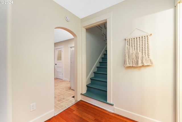 hallway with wood-type flooring