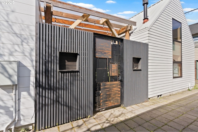 bungalow-style home with a porch and board and batten siding