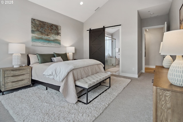 14014 NW 57th Ave, Vancouver, WA 98685 - carpeted bedroom with lofted ceiling, baseboards, connected bathroom, a barn door, and visible vents