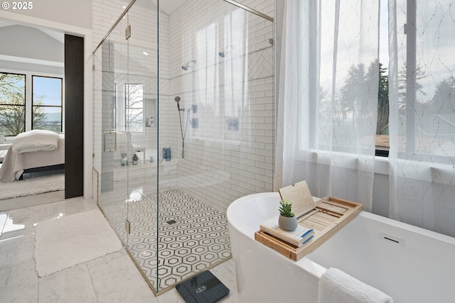 14014 NW 57th Ave, Vancouver, WA 98685 - bathroom featuring a soaking tub, marble finish floor, connected bathroom, and a stall shower