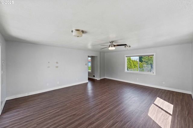 unfurnished room with baseboards, plenty of natural light, and ceiling fan