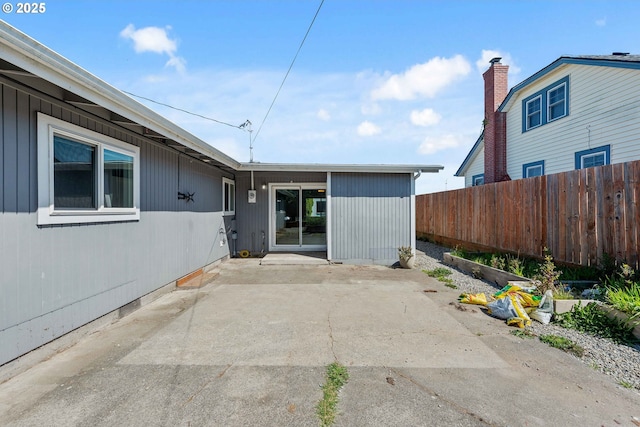 exterior space with fence and a patio area
