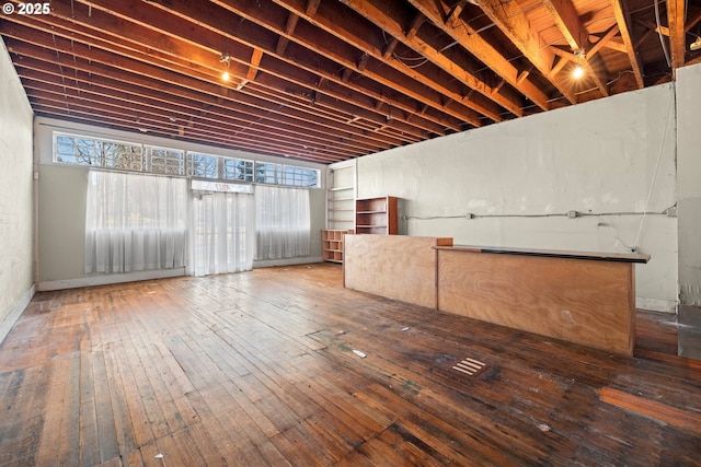 basement featuring hardwood / wood-style flooring