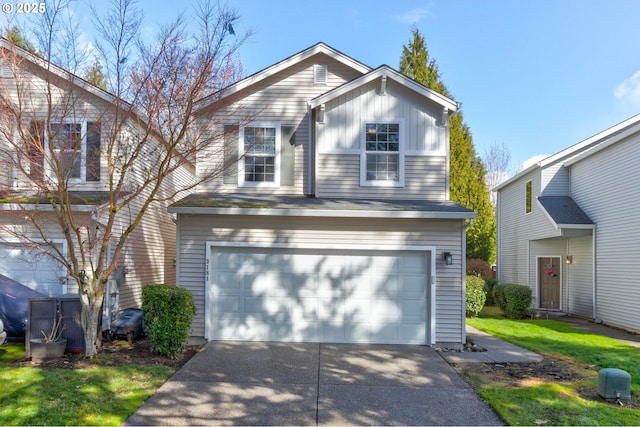 traditional-style house with an attached garage, board and batten siding, and concrete driveway