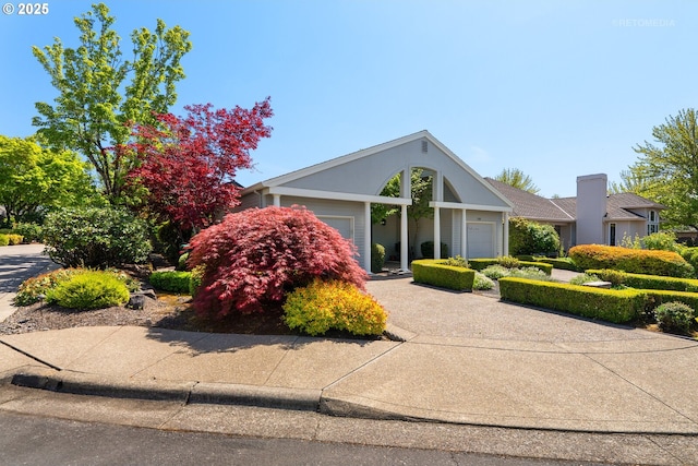 4182 NW Spoon Pl, Portland, OR 97229 - view of front of home featuring an attached garage and driveway