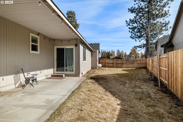 view of yard with a patio and a fenced backyard